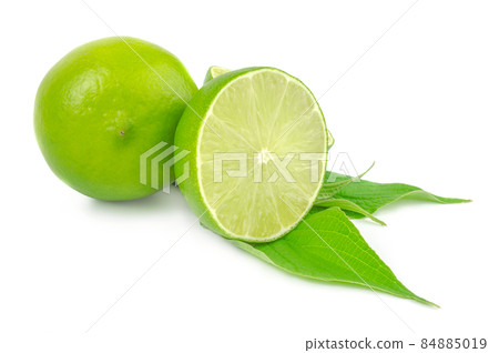 Half and whole lime isolated on white with leaves 84885019