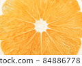 Orange citrus fruit slice macro closeup background texture 84886778