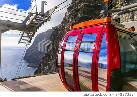 Sky road - mountain cable car Cabo Girao, popular tourist attraction and beautiful scenery in Madeira island Sky road - mountain cable car Cabo Girao, popular tourist attraction and beautiful scenery in Madeira island 84887332