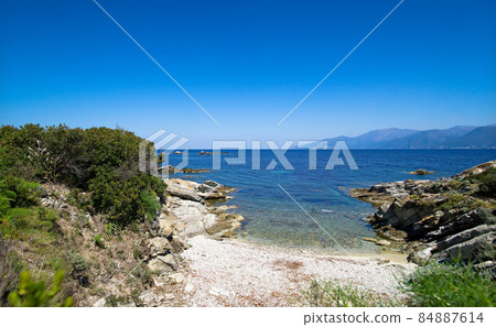 Beach with turquoise sea between the "Desert des Agriates" and Saint Florent on the west coast of Corsica 84887614