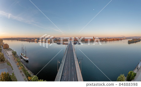 Drone panorama on the Rhine over the Theodor-Heuss bridge on the Mainz Rhine bank at sunrise 84888398