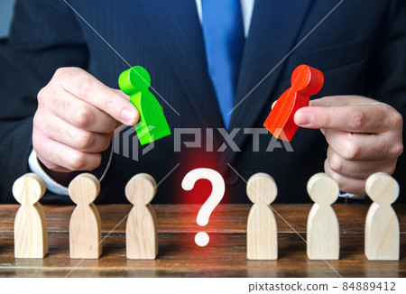 Businessman chooses a candidate for a vacancy. Hiring the best specialists in the company staff, human resources. Headhunting. Testing and interviewing new employees. Selection criteria. Leading post Businessman chooses a candidate for a vacancy. Hiring the best specialists in the company staff, human resources. Headhunting. Testing and interviewing new employees. Selection criteria. Leading post 84889412