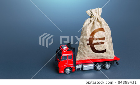 Truck with a euro money bag. Loan or deposit. Financial aid, investments and subsidies. Compensation. High super income. Cash collection. Money transfers and transactions. Pay taxes. Debt load. Truck with a euro money bag. Loan or deposit. Financial aid, investments and subsidies. Compensation. High super income. Cash collection. Money transfers and transactions. Pay taxes. Debt load. 84889431