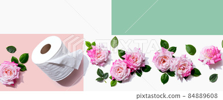 Toilet paper with pink roses overhead view Toilet paper with pink roses overhead view 84889608