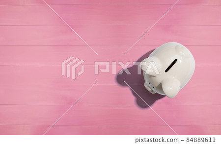 A white piggy bank overhead view A white piggy bank overhead view 84889611