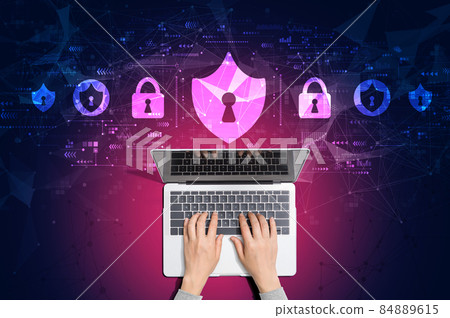 Cyber security theme with person using laptop Cyber security theme with person using laptop 84889615