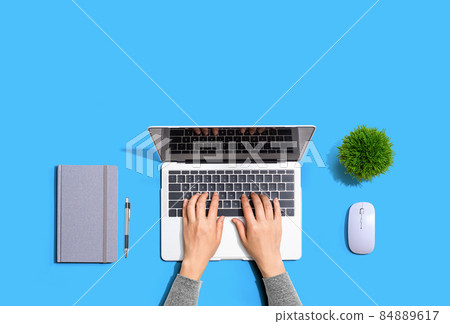 Person using a laptop computer Person using a laptop computer 84889617