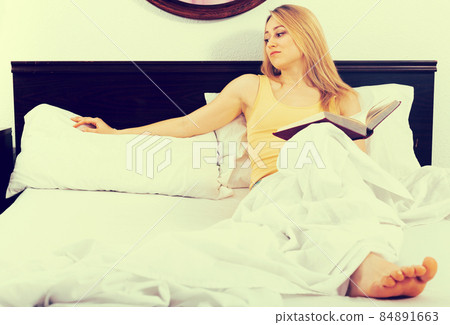 girl waiting for her husband alone on bed in bedroom girl waiting for her husband alone on bed in bedroom 84891663