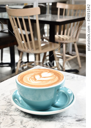 A Cup of latte art coffee A Cup of latte art coffee 84891842