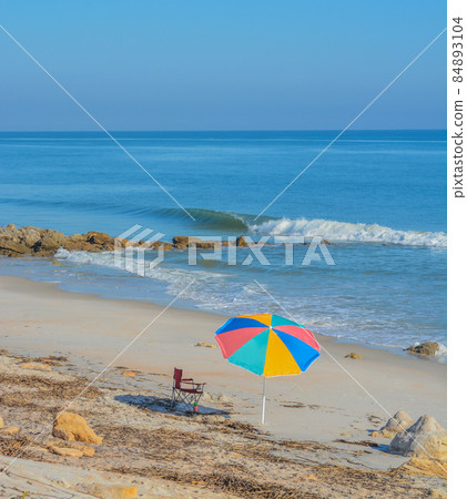 A Umbrella on the beach of the Atlantic Ocean, at Marineland Beach in Marineland, Flagler County, Florida A Umbrella on the beach of the Atlantic Ocean, at Marineland Beach in Marineland, Flagler County, Florida 84893104