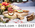Xmas cookie for Christmas and Happy New Year. Gingerbread with decoration at home. 84893197