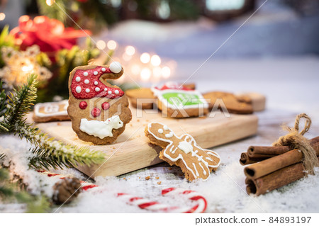 Xmas cookie for Christmas and Happy New Year. Gingerbread with decoration at home. 84893197