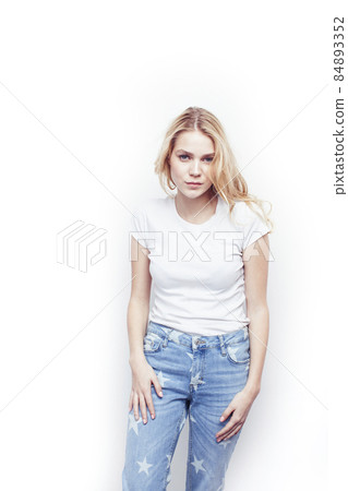 young pretty stylish blond hipster girl posing emotional isolated on white background happy smiling cool smile, lifestyle people concept young pretty stylish blond hipster girl posing emotional isolated on white background happy smiling cool smile, lifestyle people concept 84893352
