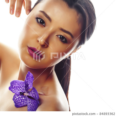 young pretty asian woman with flower purple orchid isolated on white background, spa people concept young pretty asian woman with flower purple orchid isolated on white background, spa people concept 84893362