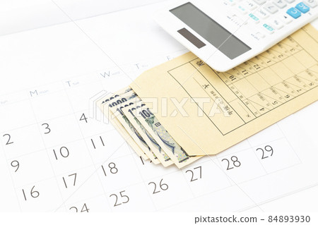 Monthly bag and calculator white background 84893930