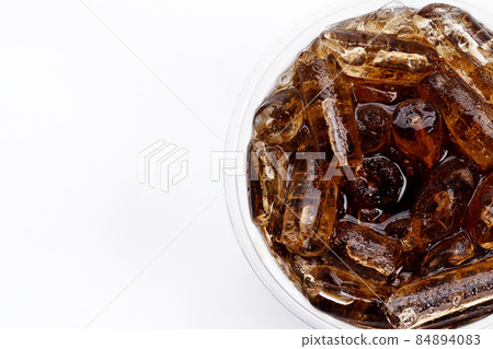 Cola with ice in take away cup on white background. Cola with ice in take away cup on white background. 84894083