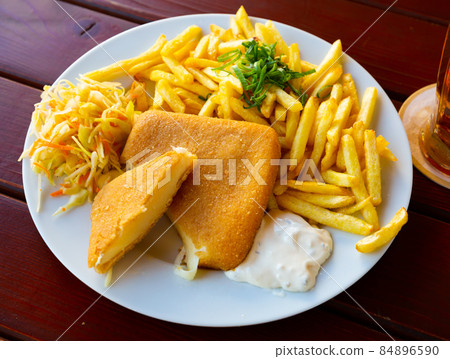 Fried cheese with fries and tartar 84896590