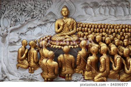 Life of Buddha, preaching to disciples, Thai Chiang Mai Wat Chainmongkon main hall outer wall relief 84896977
