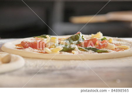 Pizza craftsman making pizza Pizza craftsman making pizza 84898565