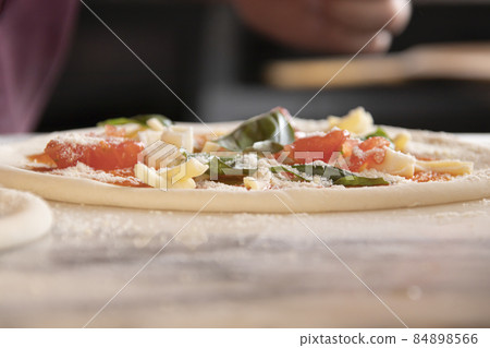 Pizza craftsman making pizza Pizza craftsman making pizza 84898566
