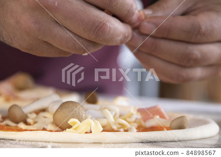 Pizza craftsman making pizza Pizza craftsman making pizza 84898567