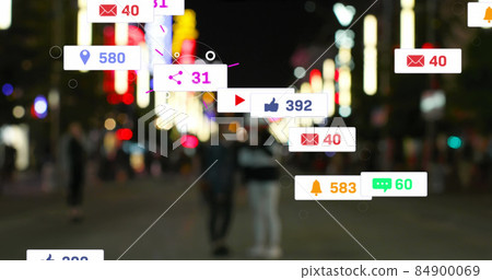 Image of social media icons and numbers over out of focus city and traffic lights 84900069