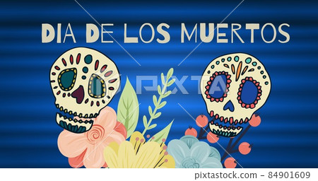 Dia de los muertos text with skulls and flowers against blue background, copy space 84901609