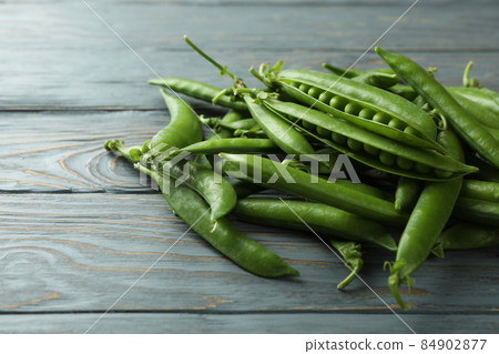 Fresh green pea on gray wooden table 84902877