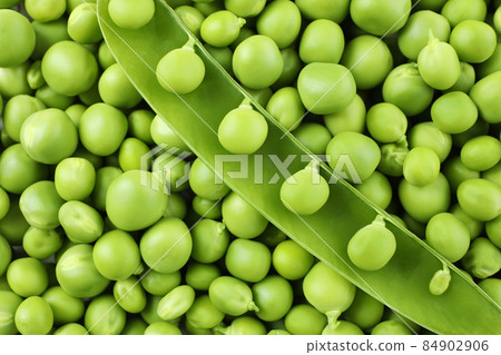 Green pea seeds on whole background, close up Green pea seeds on whole background, close up 84902906