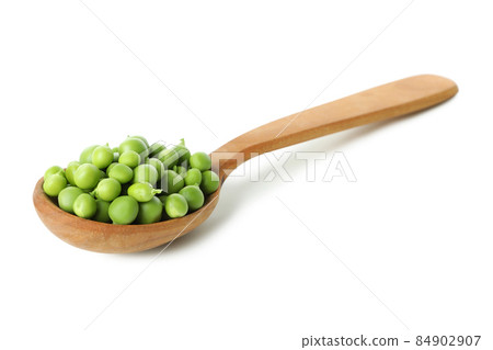 Spoon with pea seeds isolated on white background Spoon with pea seeds isolated on white background 84902907