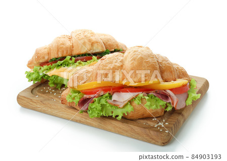 Board with croissant sandwiches isolated on white background 84903193