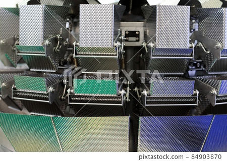 close up of multihead weigher with steel buckets 84903870