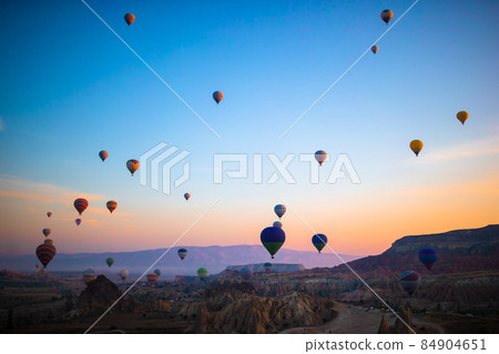 Bright hot air balloons in sky of Cappadocia, Turkey 84904651