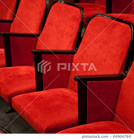 Modern cinema hall empty and red comfortable seats 84904769
