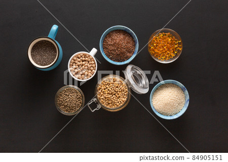 Source of vitamin E and nutrients in bowls on the table, copy space Source of vitamin E and nutrients in bowls on the table, copy space 84905151