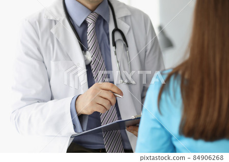 Man doctor in uniform and stethoscope consult woman patient 84906268