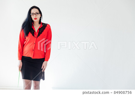 beautiful brunette woman in business clothes in a white office beautiful brunette woman in business clothes in a white office 84908756