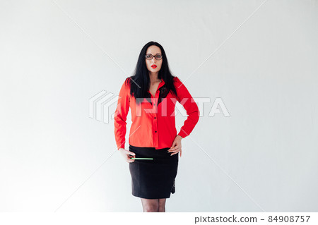 beautiful brunette woman in business clothes in a white office beautiful brunette woman in business clothes in a white office 84908757