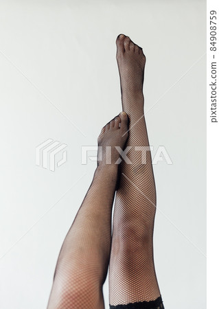 beautiful slender women's legs in black stockings beautiful slender women's legs in black stockings 84908759
