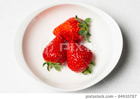 Strawberry on a plate 84910787