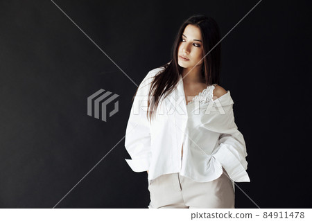 beautiful oriental brunette woman in a white shirt 84911478