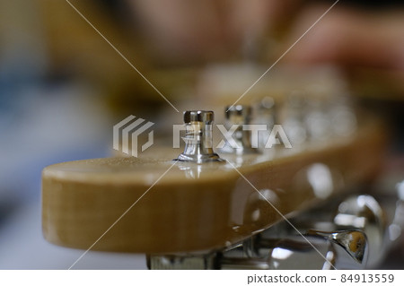 Electric guitar peg post close-up 1 84913559
