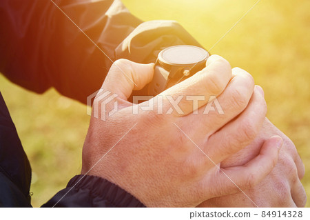 Sport watch at man wrist 84914328