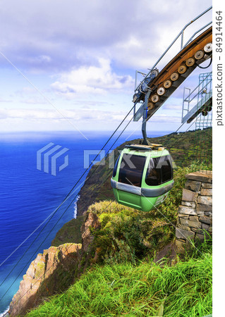 Achadas da Cruz cable car in Madeira island, western part. Spectacular sea and rocky mountains scenery, popular tourist attraction Achadas da Cruz cable car in Madeira island, western part. Spectacular sea and rocky mountains scenery, popular tourist attraction 84914464
