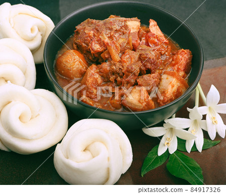 braised pork belly meat wrapped with mantou bun Chinese. braised pork belly meat wrapped with mantou bun Chinese. 84917326