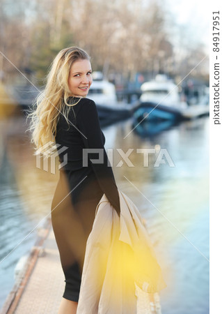 young blond slavic woman with long hair street portrait with glasses on marina boat background young blond slavic woman with long hair street portrait with glasses on marina boat background 84917951