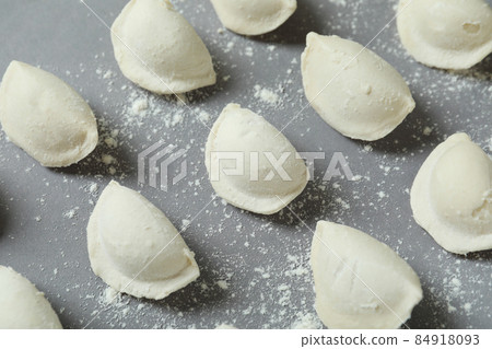 Concept of cooking vareniki or pierogi on gray background Concept of cooking vareniki or pierogi on gray background 84918093