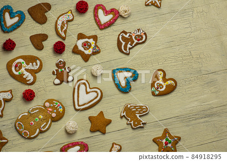 Homemade gingerbread cookies on table. Christmas holiday background Homemade gingerbread cookies on table. Christmas holiday background 84918295