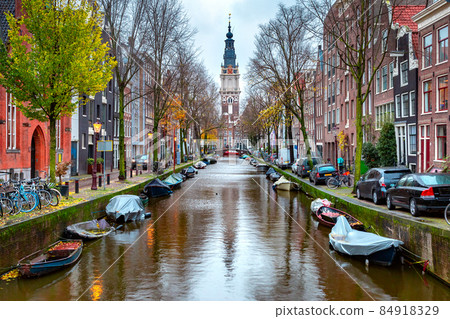 Amsterdam canal with Zuiderkerk Amsterdam canal with Zuiderkerk 84918329