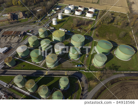 Drone shot of steel round Oil Storage Tanks close up 84918566
